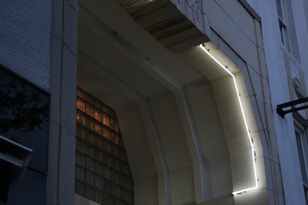 A serene architectural detail showcasing smooth curves and warm natural light highlighting premium materials.