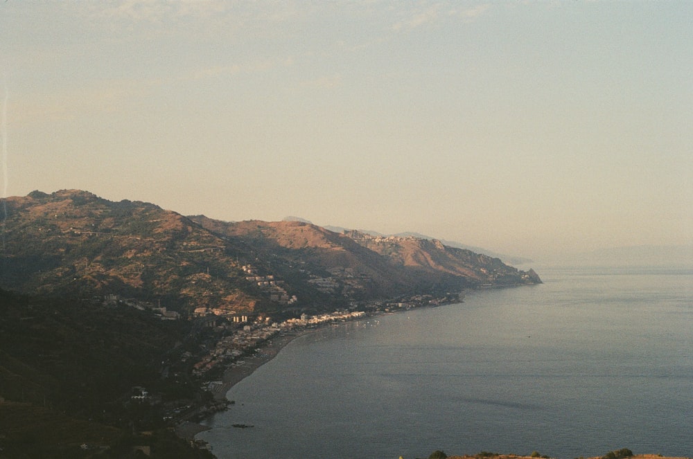 a body of water with hills around it