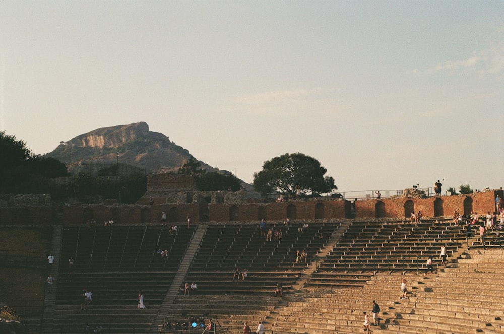 an ancient stadium with people in it