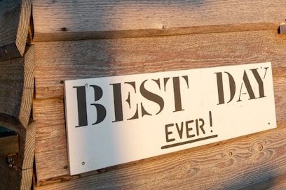 a sign on a wood wall