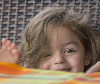 a child lying on a bed