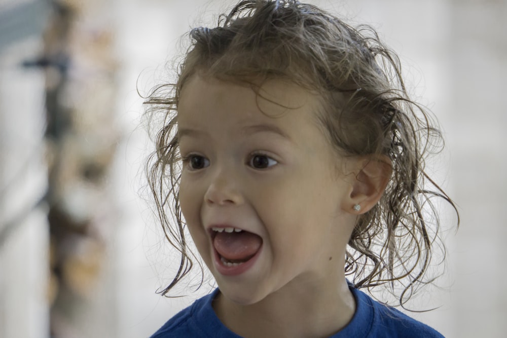 a child with her mouth open