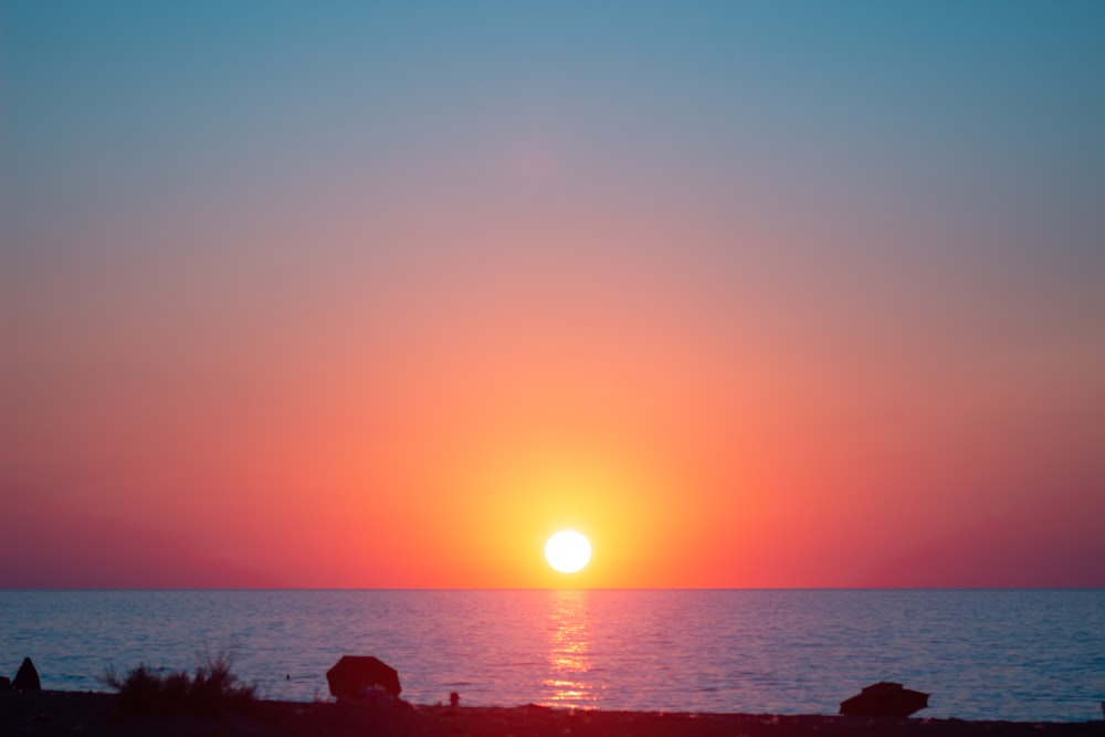 a sunset over the ocean