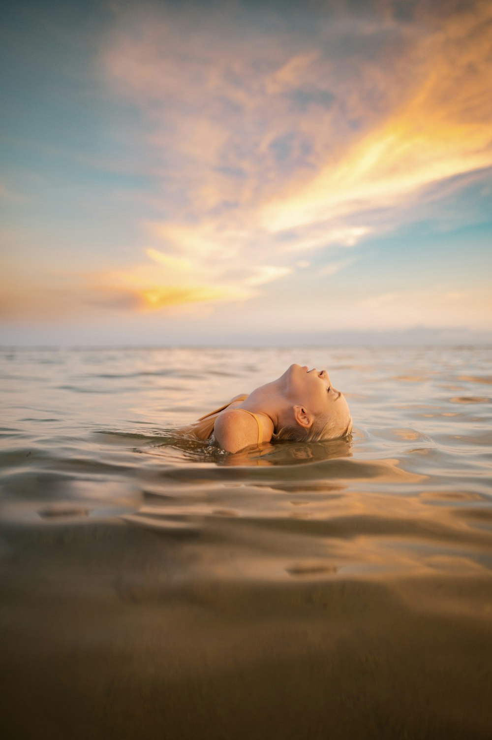 a person lying in the water