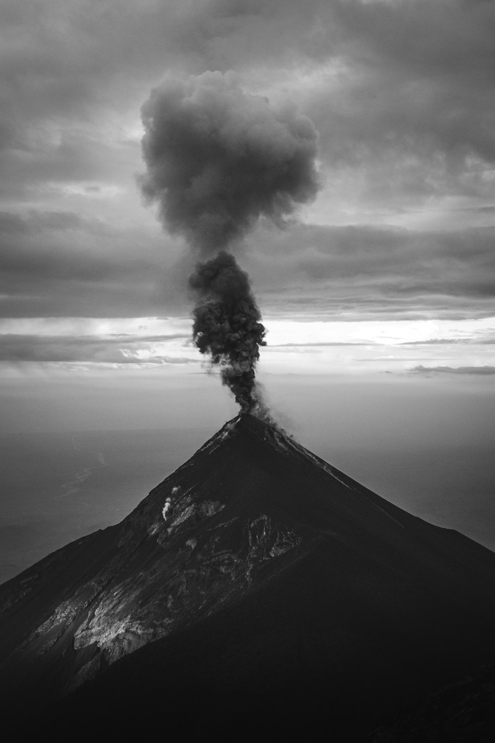 a volcano erupting with smoke
