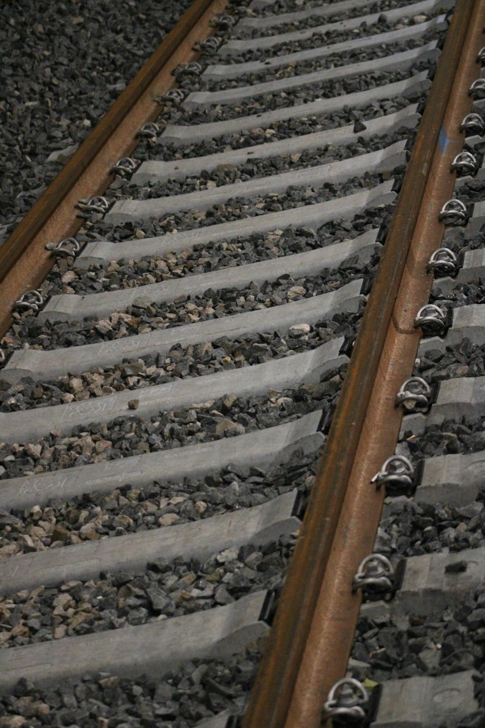 a railroad track with rocks