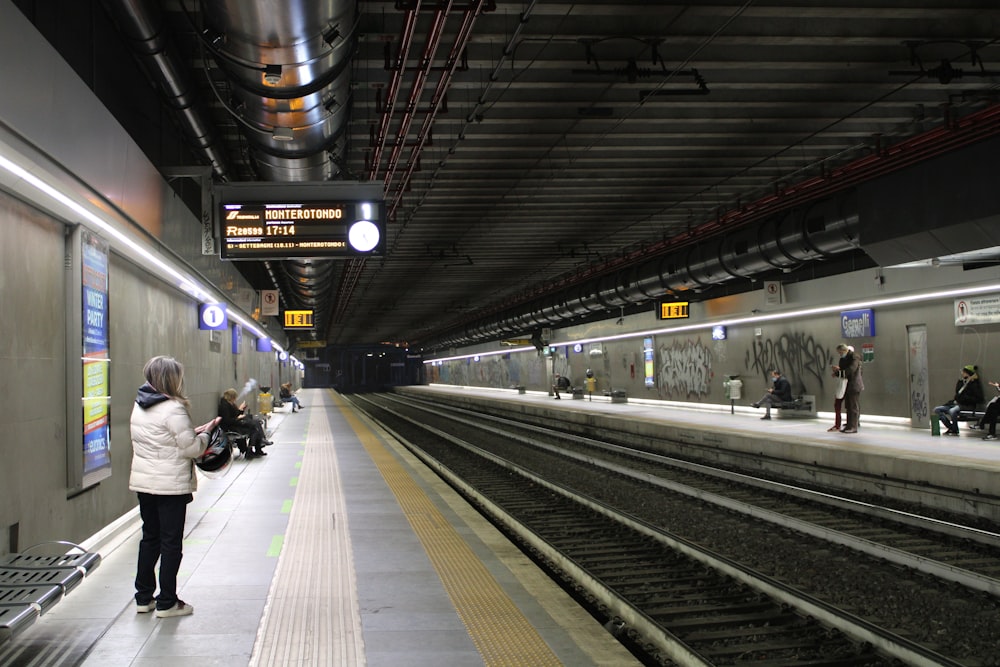 a person waiting at a train station