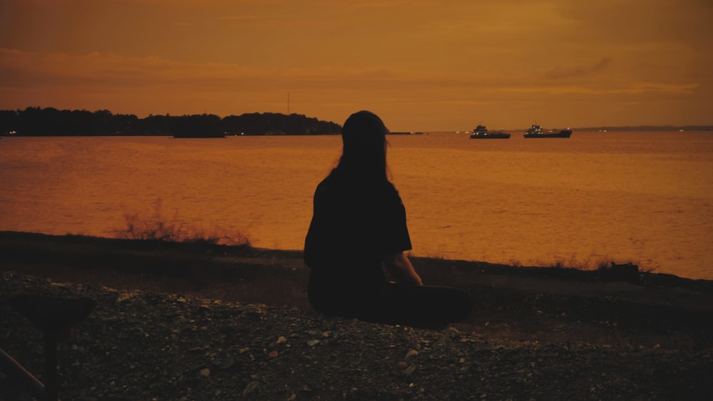 a person sitting on a beach