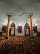 A spacious room featuring a large bespoke carpet from tauquir international.