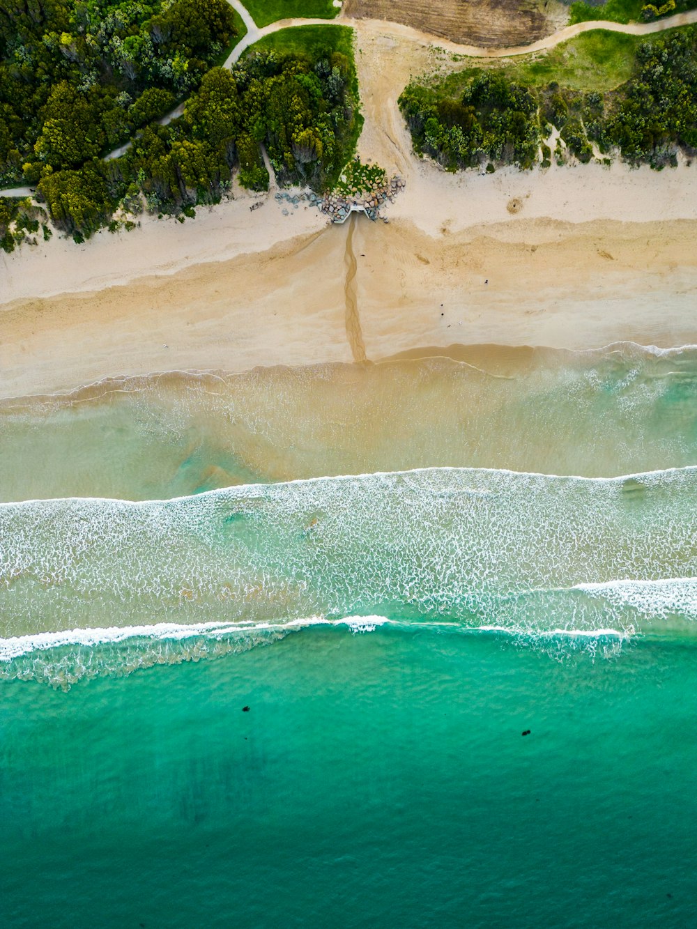 a beach with a body of water