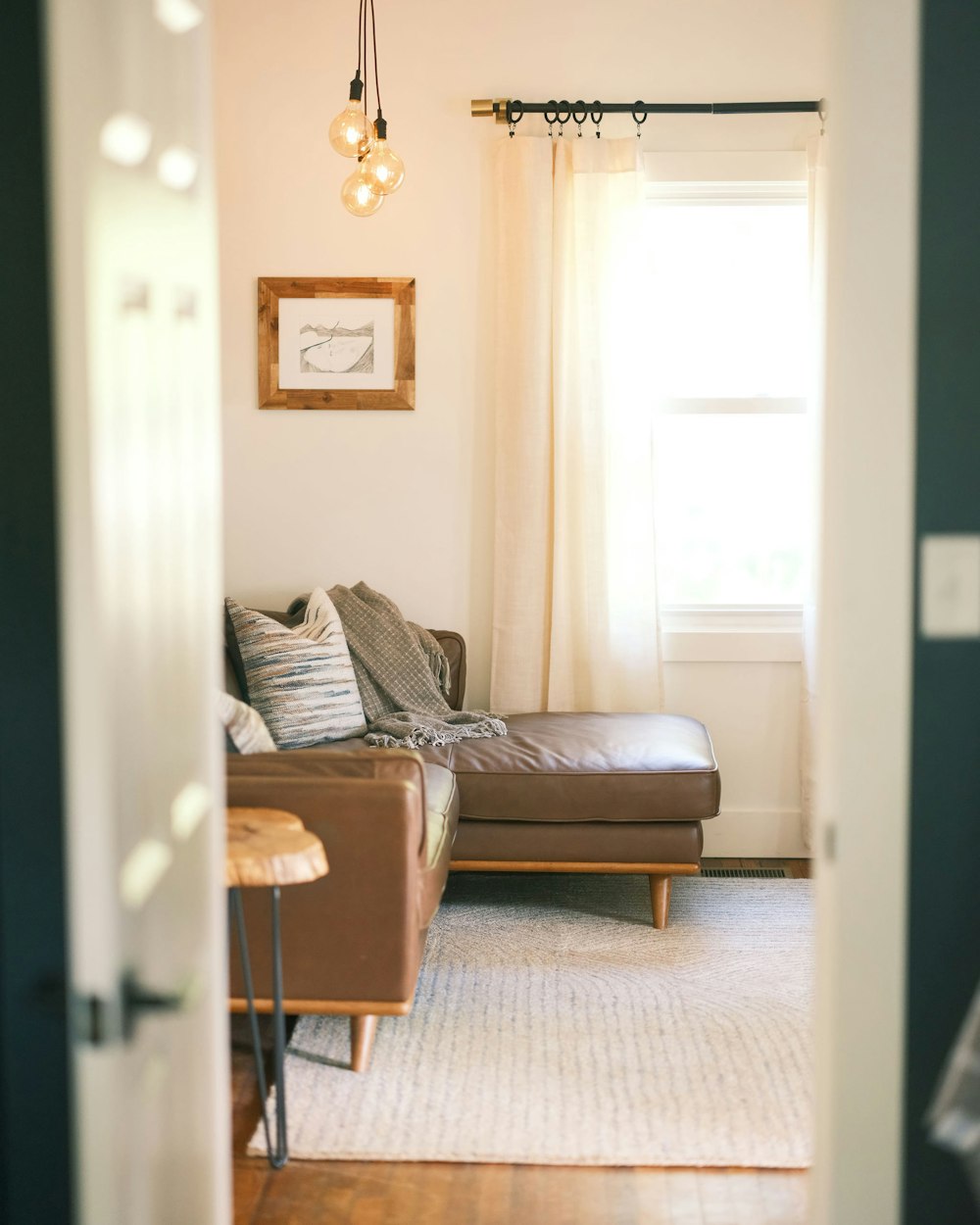 a living room with a couch and a chair