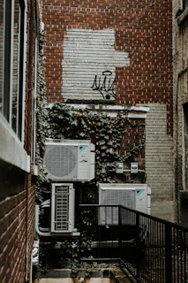a brick building with a planter box on the window