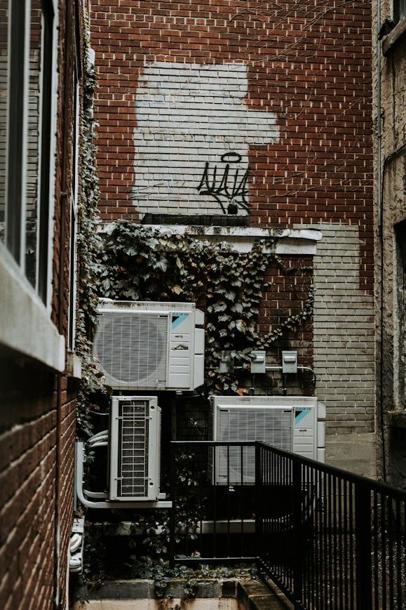 a brick building with a planter box on the window