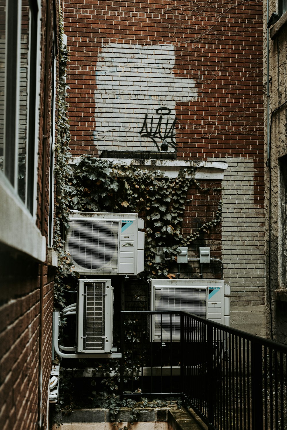 a brick building with a planter box on the window