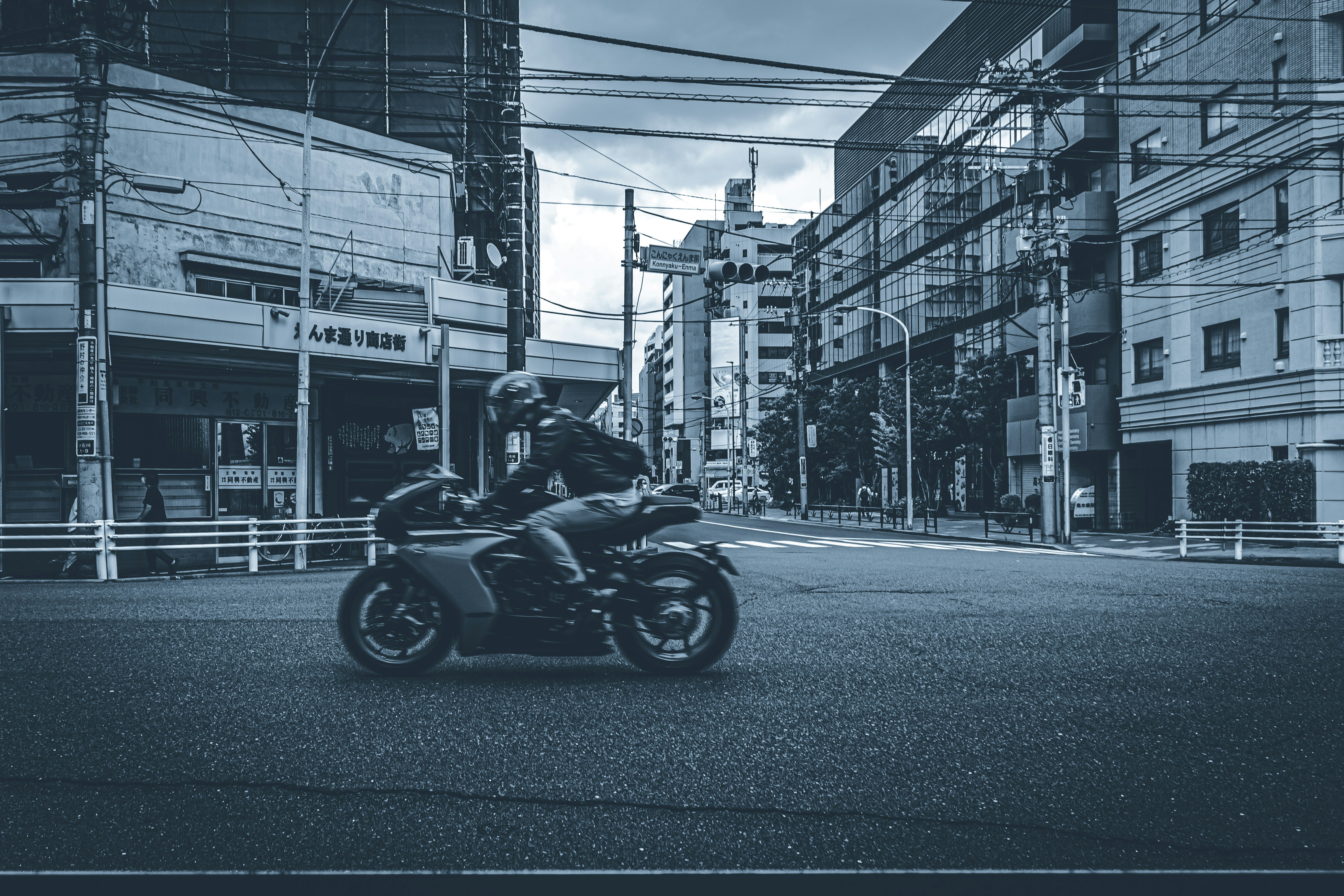 a person riding a motorcycle down a street