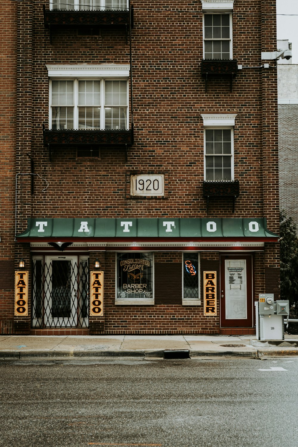 a brick building with a sign on it