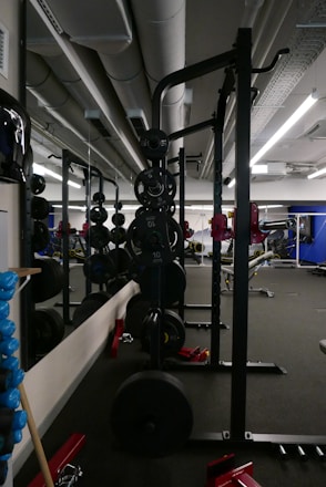A vibrant image of a fitness coach guiding an athlete in a gym.