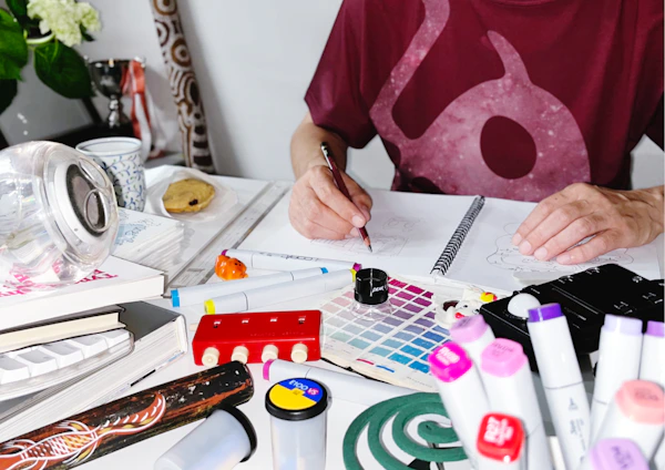 a person writing on a piece of paper