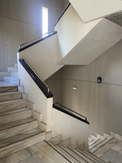 Detail of white marble stair railing and steps highlighting the smooth finish and durability.