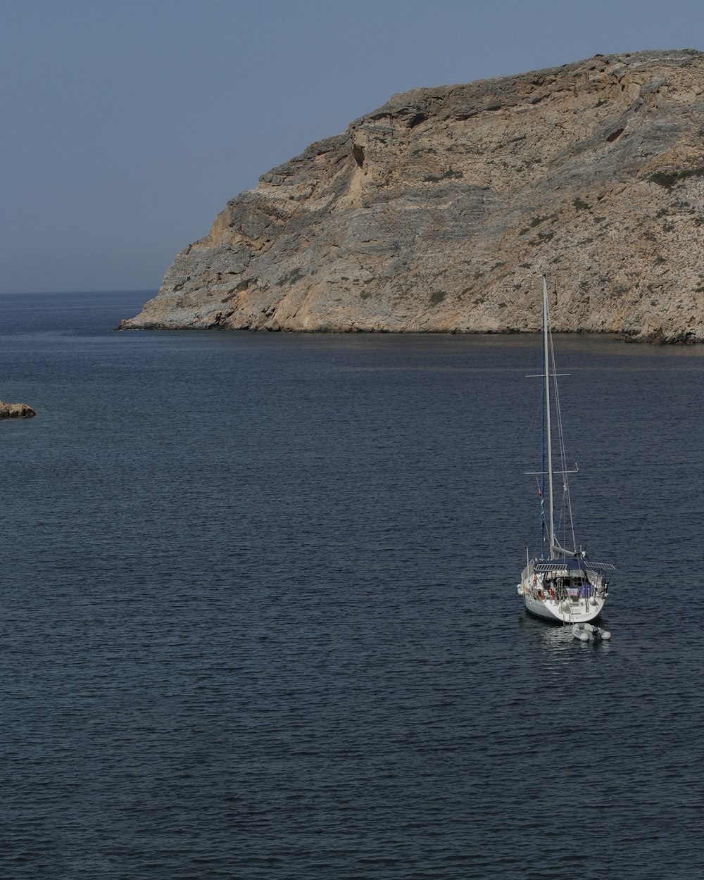 a small boat in a large body of water