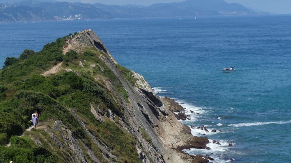 a cliff next to the ocean