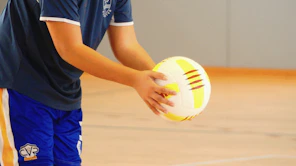 a person holding a ball
