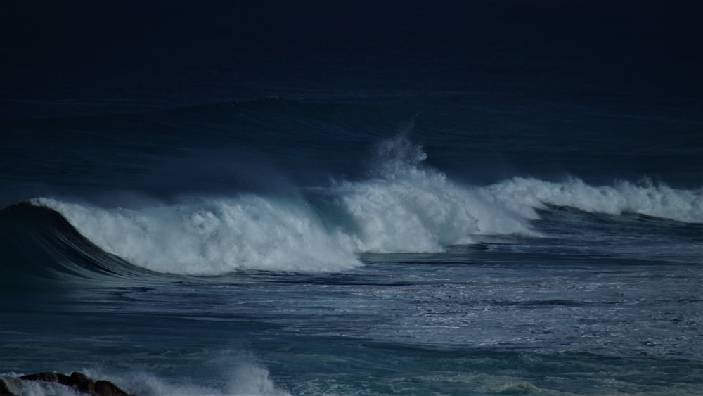 a wave crashing on a beach