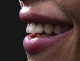 a person's mouth with teeth and tongue sticking out