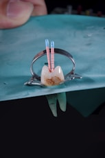 a cup with a spoon and a cup with a straw