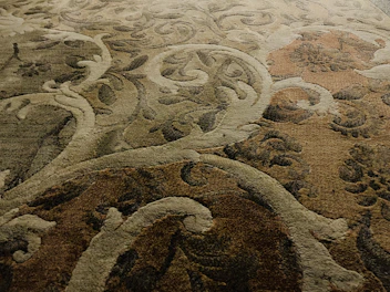 Modern Arabic carpet with abstract designs and a soft color palette.