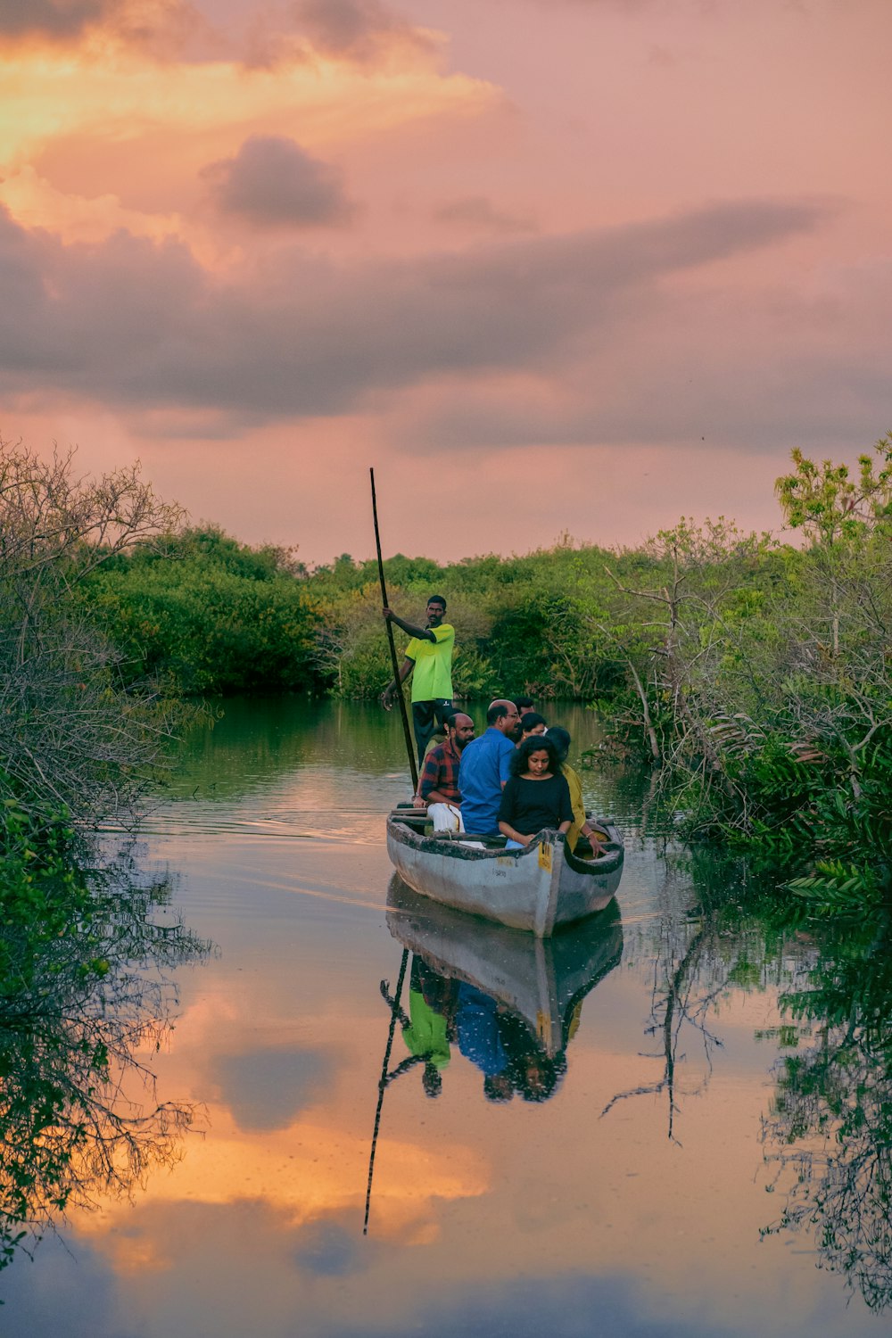 a group of people on a boat in a river