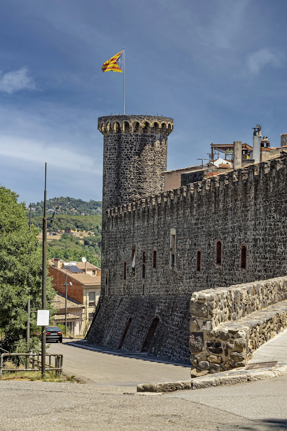 a stone castle with a flag on top