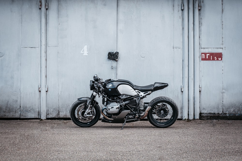 a motorcycle parked in front of a garage