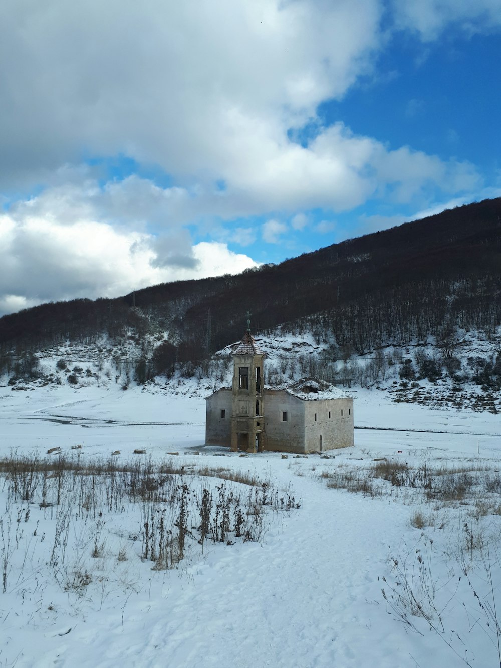 a building in a snowy landscape