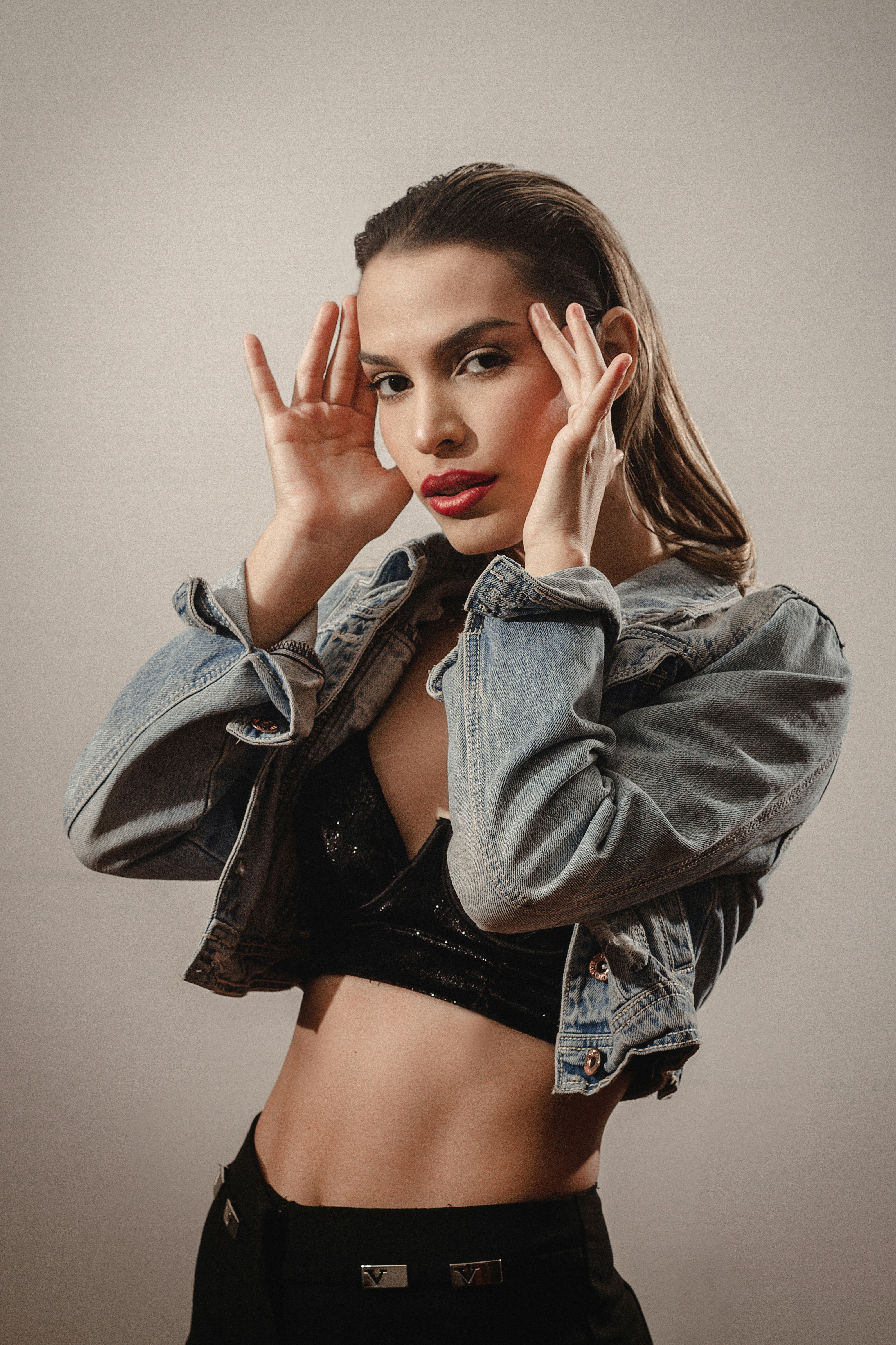 a person with the hands on the face