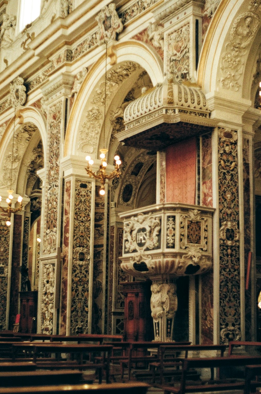 a large ornate room with a statue