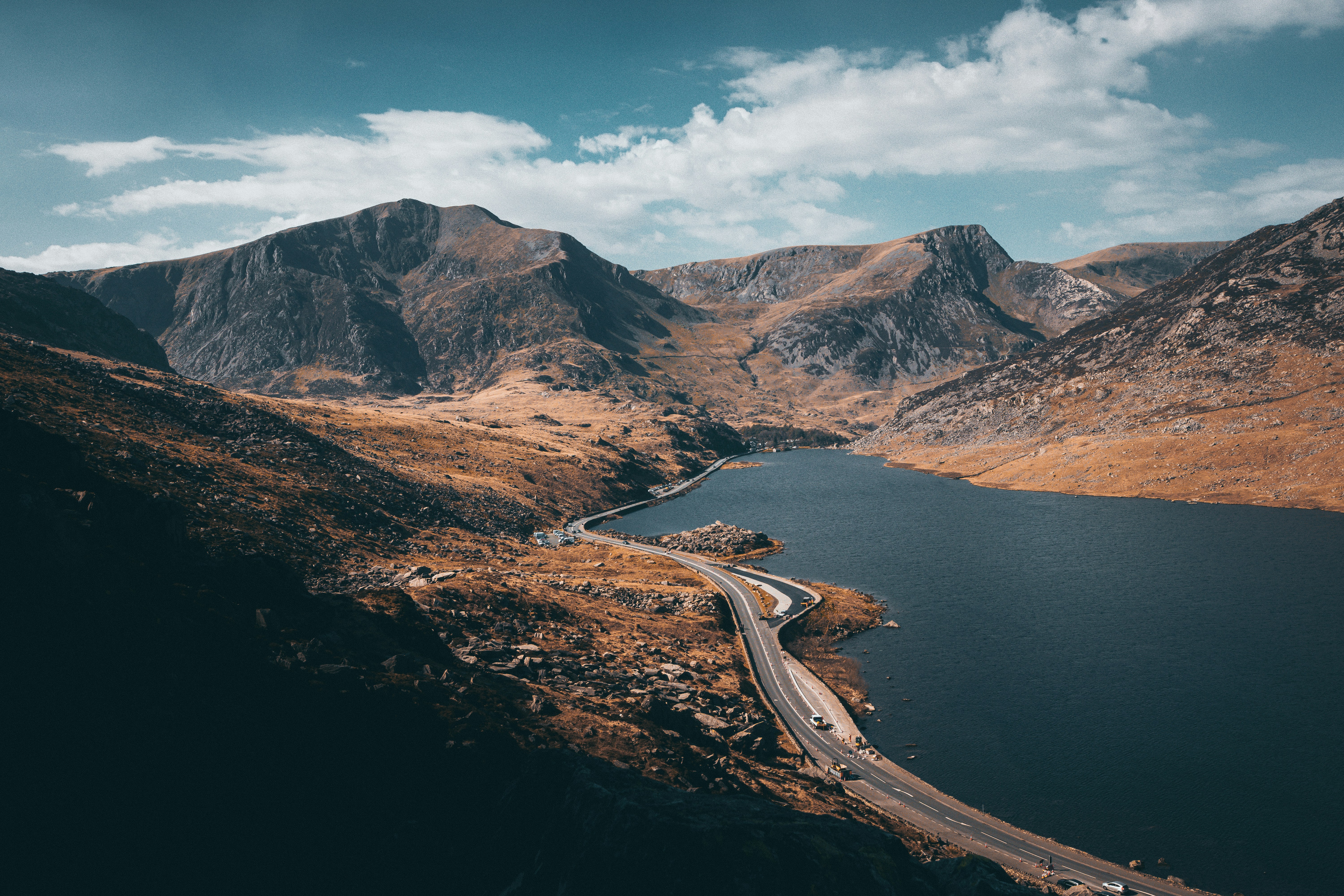 a river running through a valley between mountains