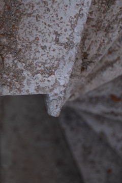 Close-up image of a rugged anti-slip stair cover enduring heavy industrial use outdoors.