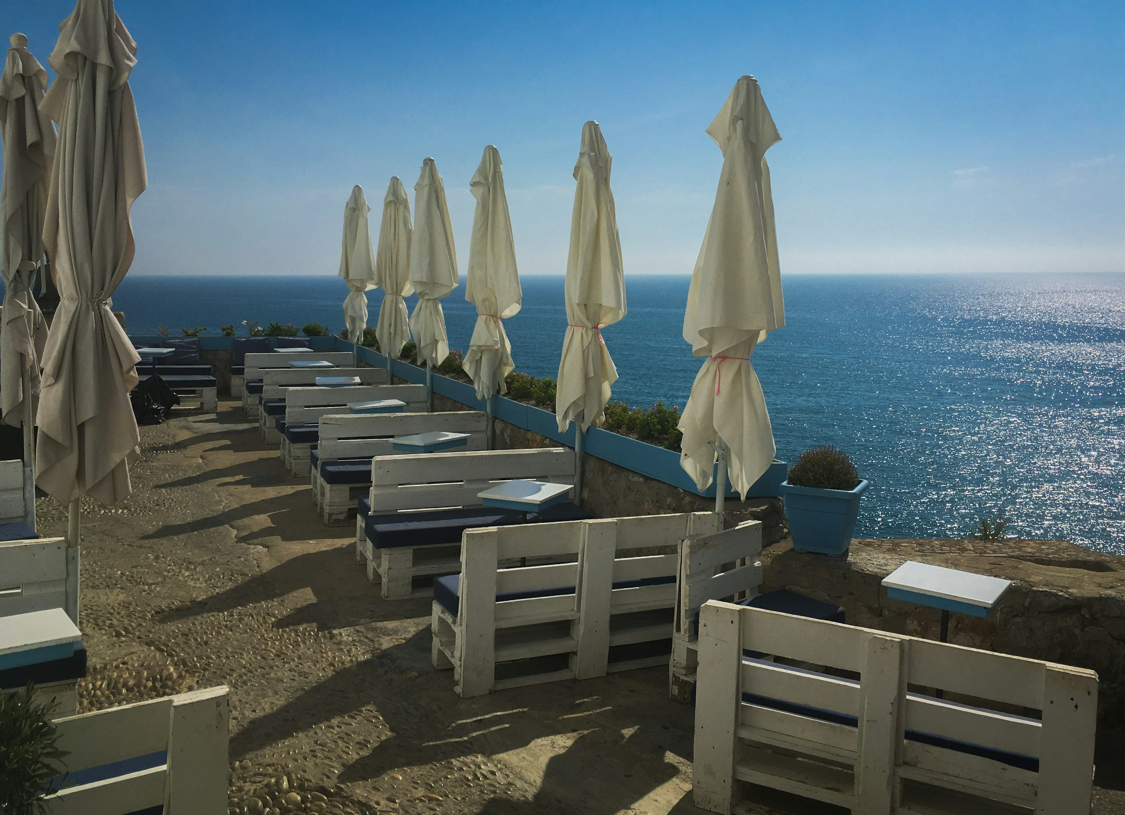 Outdoor cafe seating with ocean view