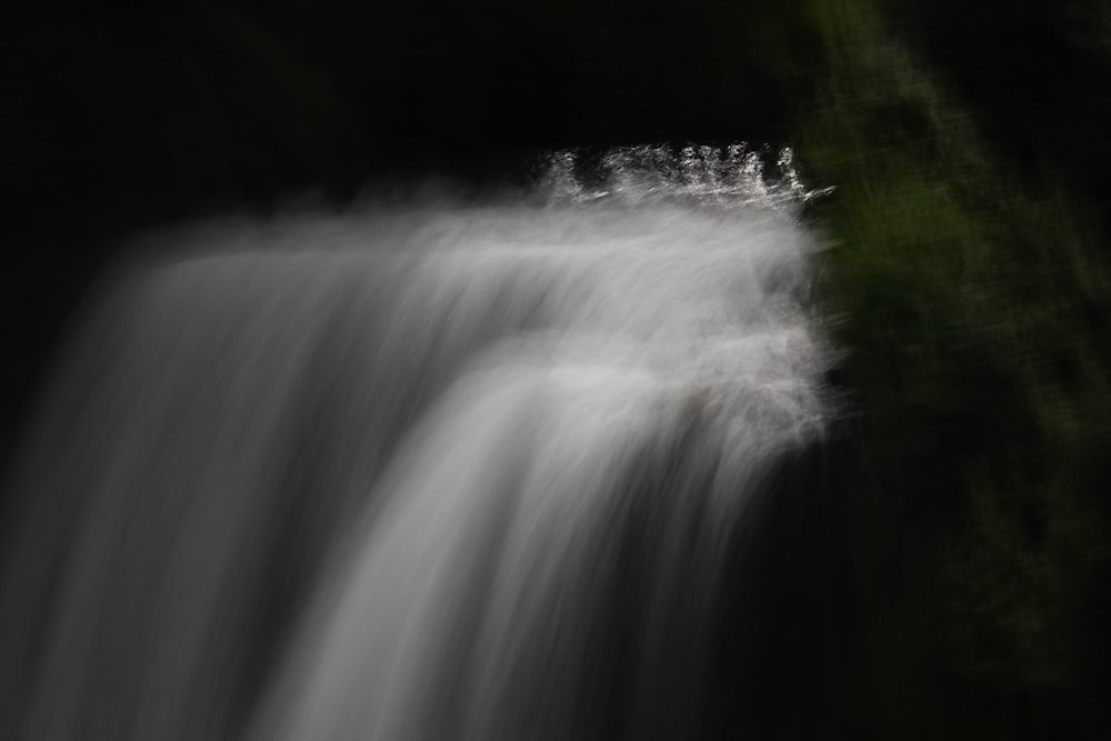 a waterfall in a dark place