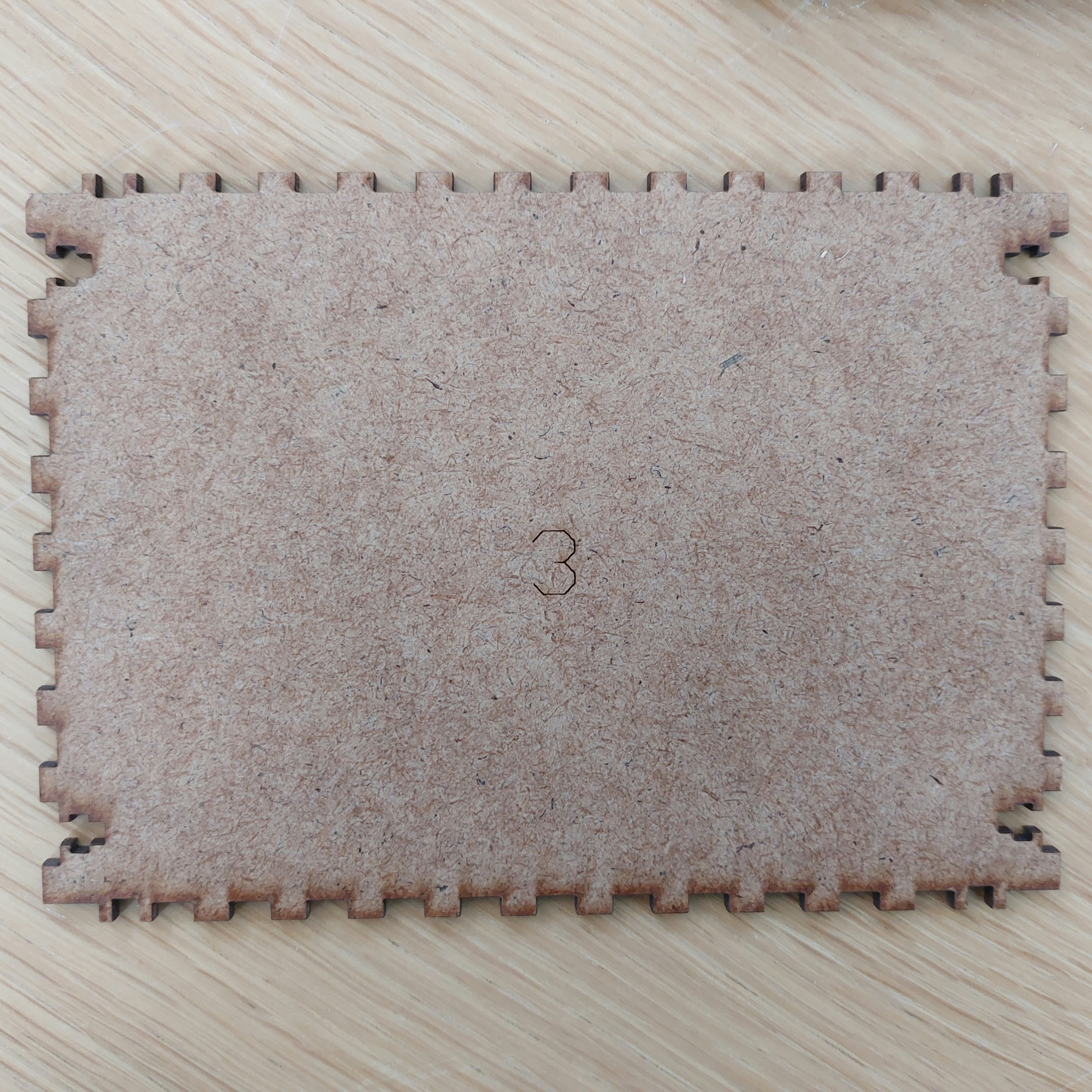 Wooden number puzzle board with colorful numbered pieces fitting into corresponding slots