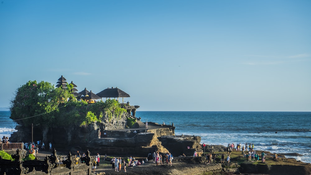 a beach with people and buildings