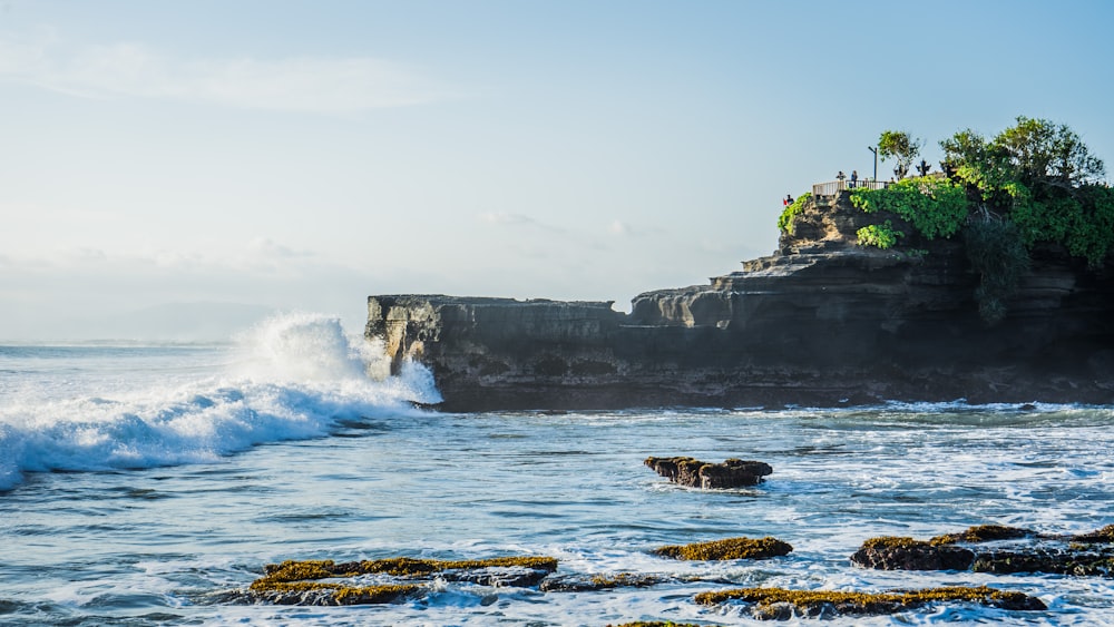 waves crashing against a rock wall