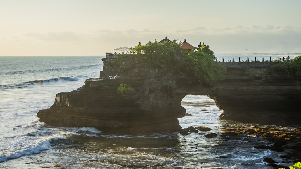 a building on a cliff by the ocean