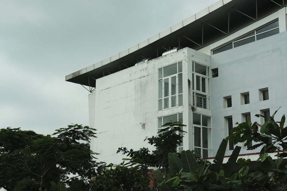 a white building with a black roof