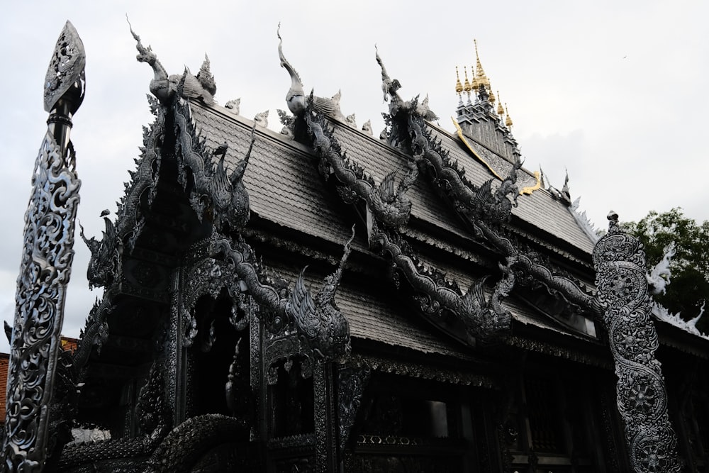 a building with statues on the roof