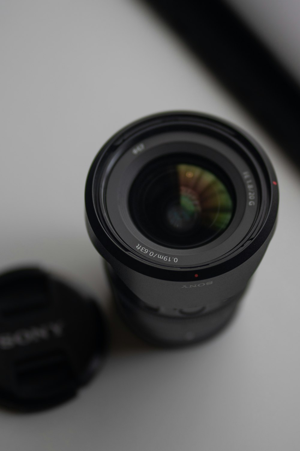 a camera lens on a white surface