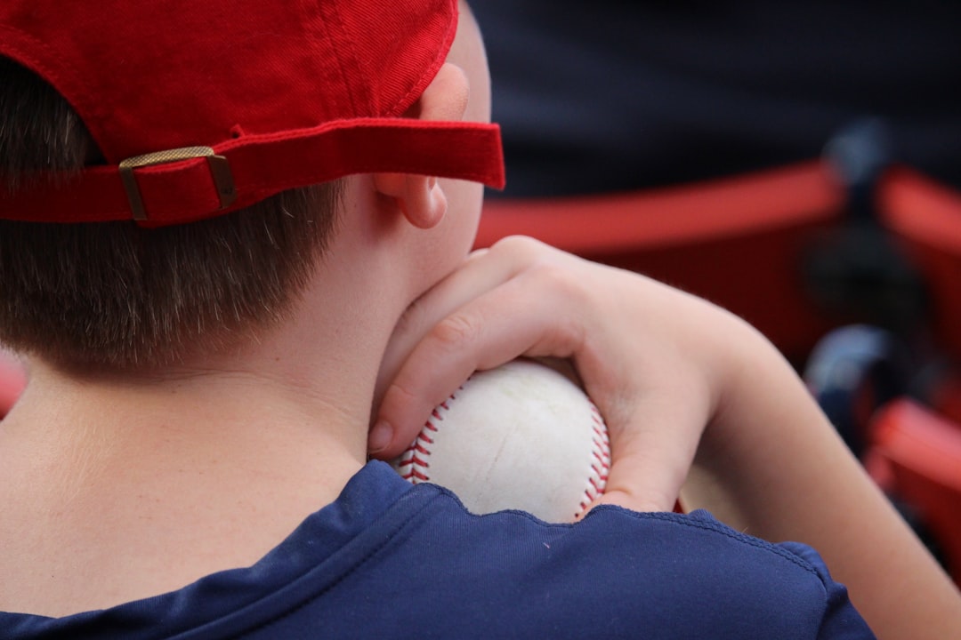 a person holding a white object to their mouth, It feels good to have a hardball in a soft place