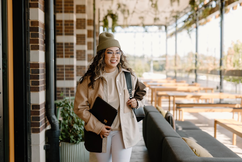 a woman with a backpack smiling