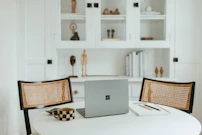 Cozy workspace featuring sleek furniture and subtle decorative elements in a bright room.